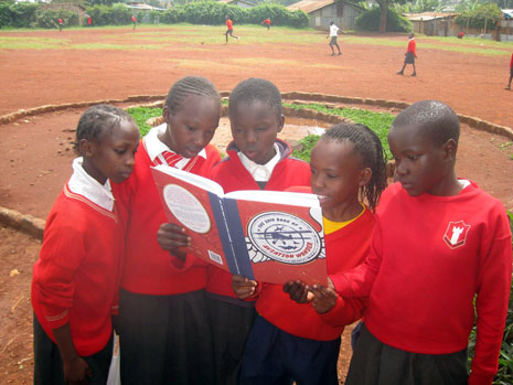 Pupils at Desai Memorial Primary School, Kawangware, Kenya are enjoying the book. The photo was taken by Virgin Atlantic pilot Bob Ilett who regularly visits the school to bring donations of books, clothes, sports equipment and stationery.